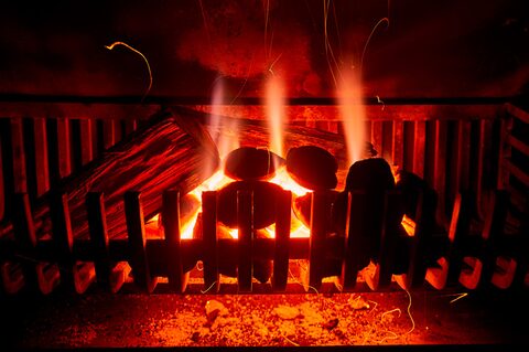 A wood fire burning in the fireplace at The Loft in Clarens