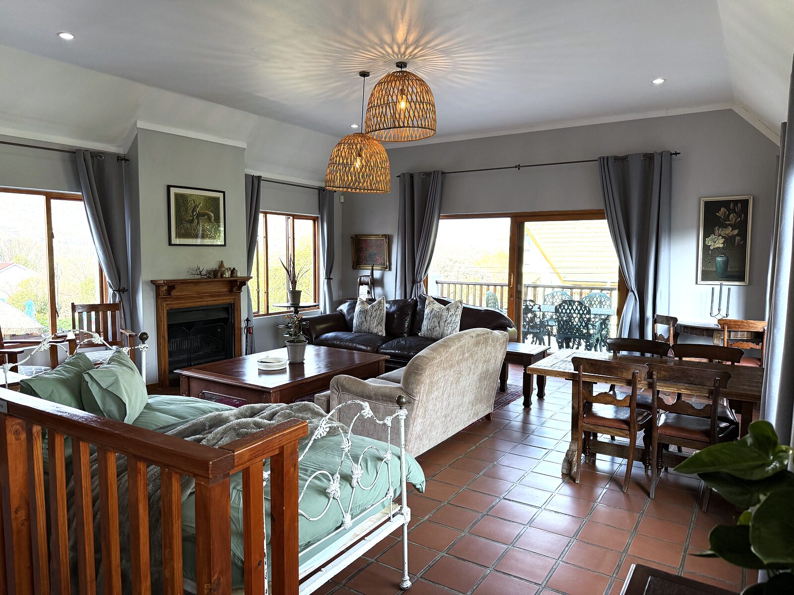 Open living and dining area in The Loft with doors onto the patio