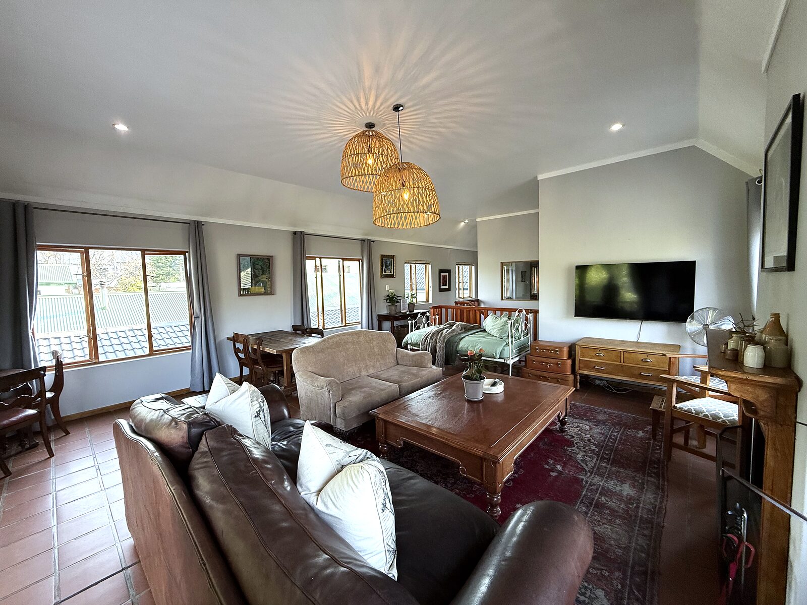 The Loft living room looking through to the dining table and balcony