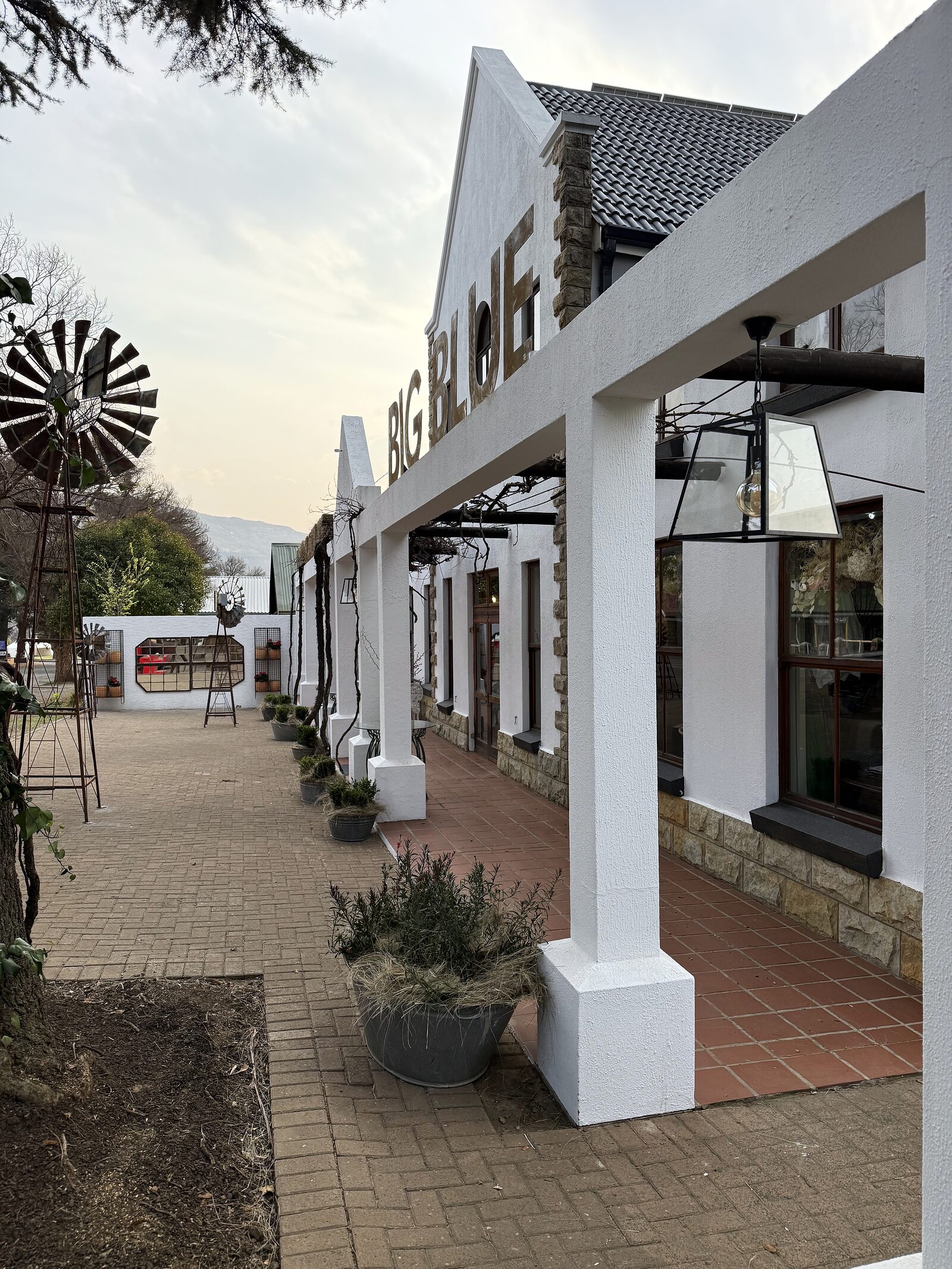 Sandstone veranda and shopfront on the village square in Clarens