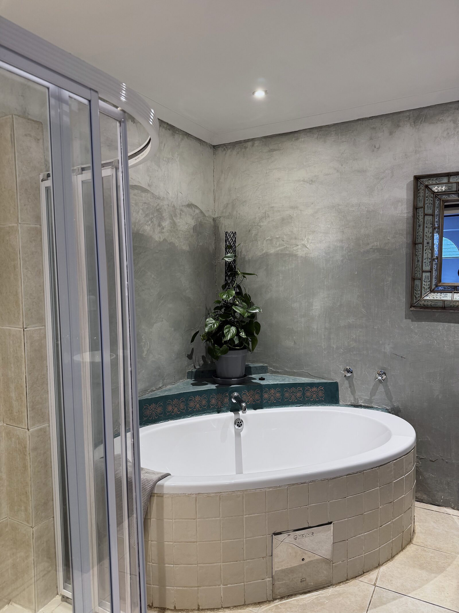 En-suite bathroom in The Studio with a generous corner bath
