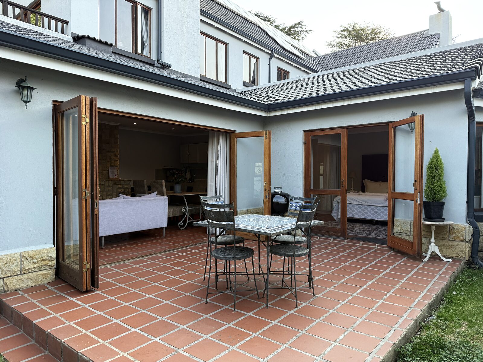 The Studio at Stay in Clarens — A one-bedroom cottage tucked behind the shop, with a corner bath and a private garden patio.